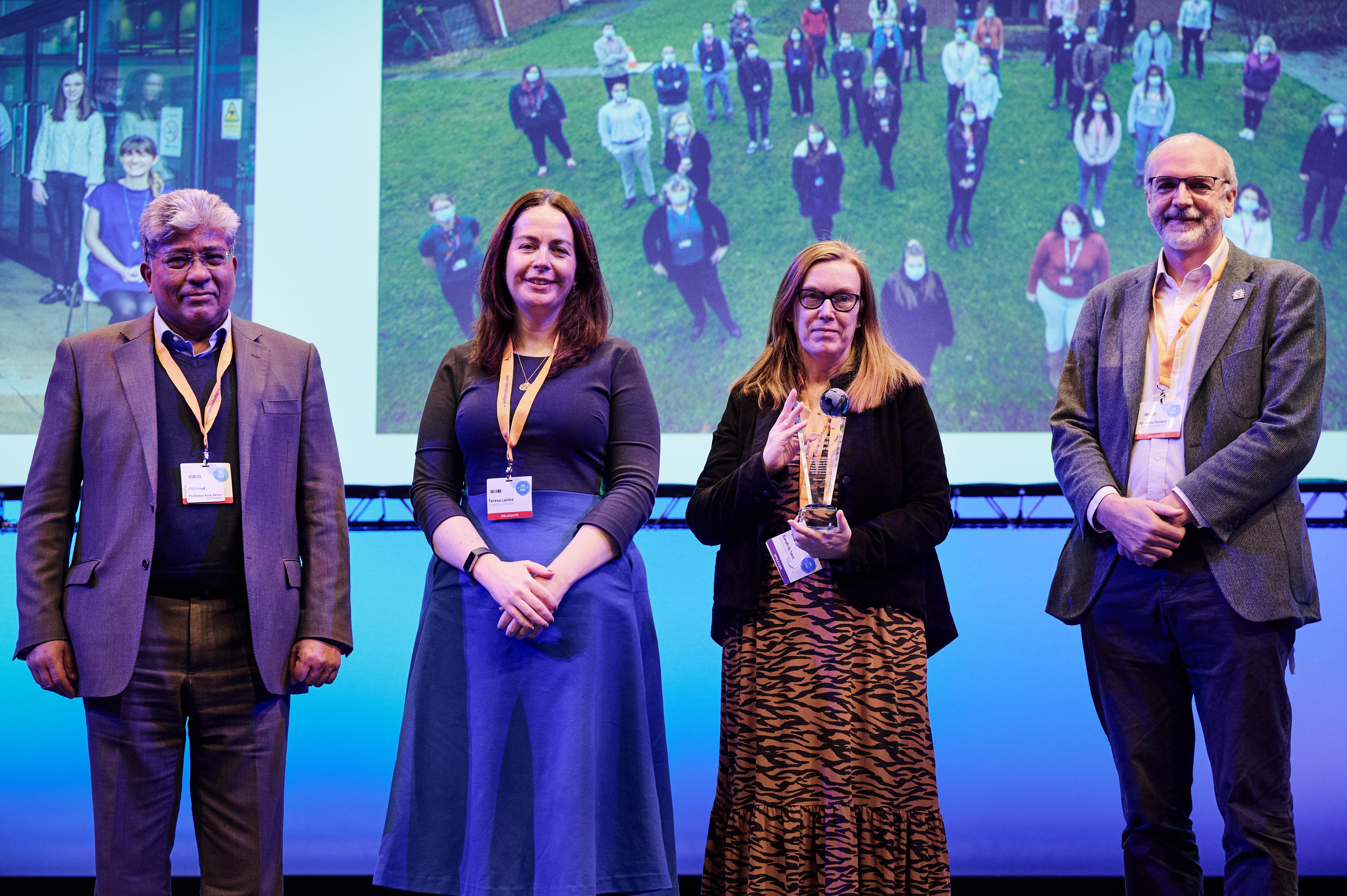Awarding the BSI Global Impact & Innovation Award to the Oxford/AstraZeneca COVID-19 vaccine team. The award was accepted by Prof Teresa Lambe, Prof Sarah Gilbert & Prof Andrew Pollard on behalf of the wider group. Awarding the BSI Global Impact & Innovation Award to the Oxford/AstraZeneca COVID-19 vaccine team. The award was accepted by Prof Teresa Lambe, Prof Sarah Gilbert & Prof Andrew Pollard on behalf of the wider group.