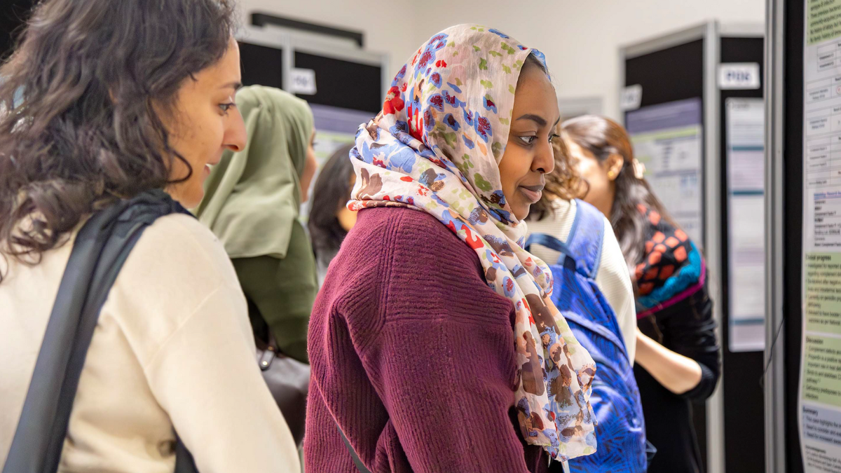BSI-CIPN Conference 2024 delegates discussing scientific poster