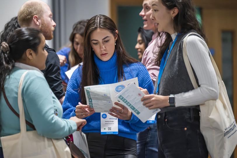 Delegates looking at congress programme