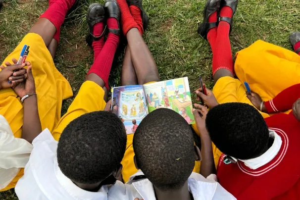 students reading a comic book