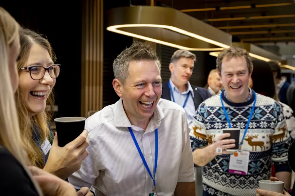 Dr Doug Brown laughing with colleagues