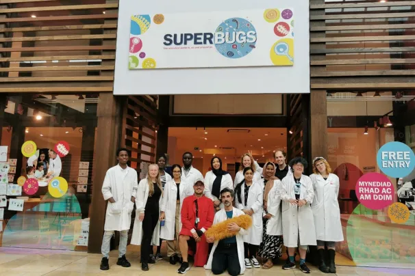 A group of immunologists standing in front of their Superbugs pop up shop in Cardiff